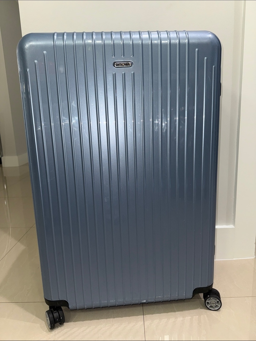 RIMOWA Salsa Air Multiwheel acrylic suitcase in Ice Blue.